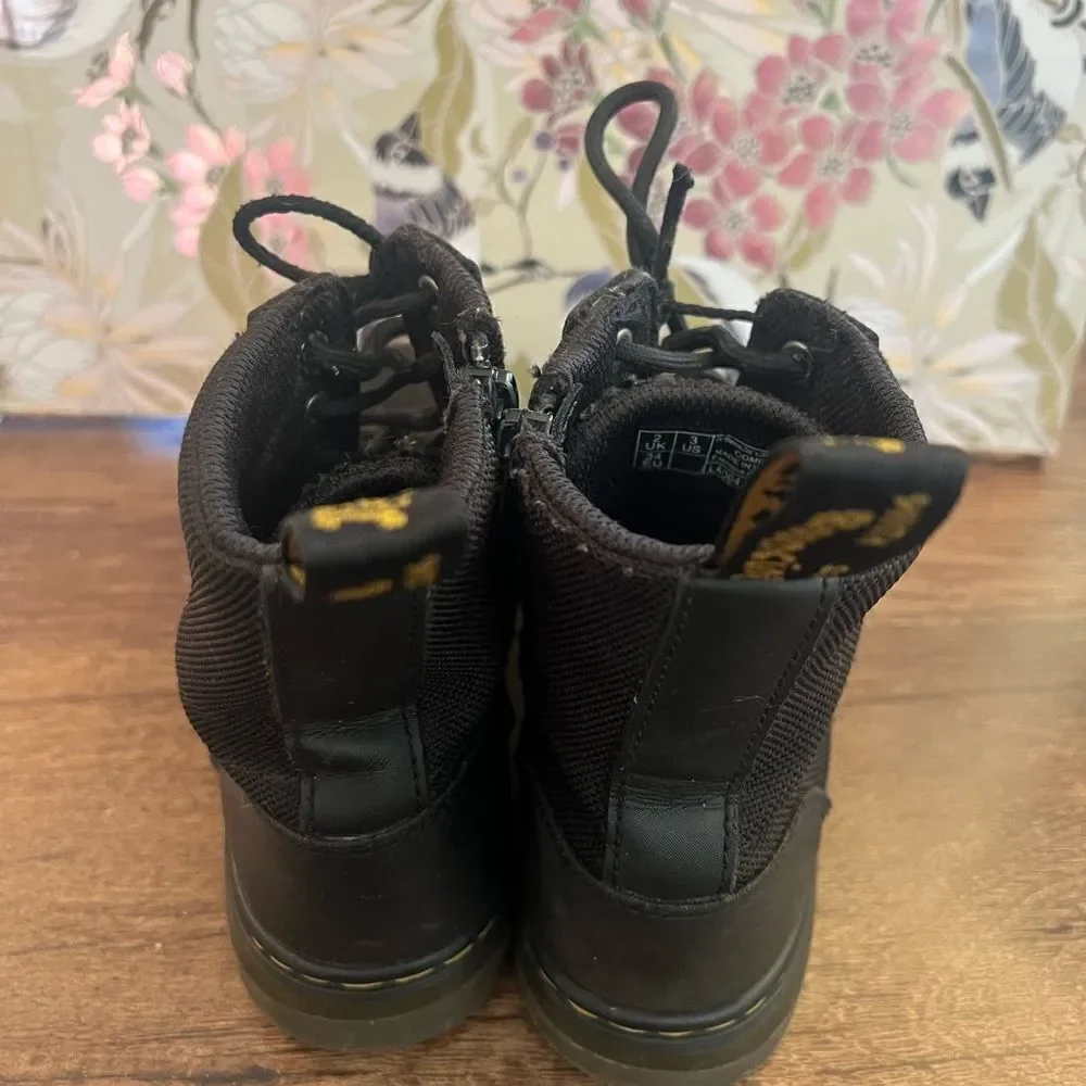 Dr. Martens Black Lace-Up Boots with side zipper.